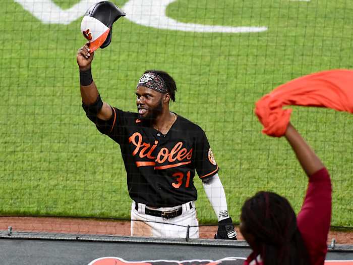 Jun 18, 2021; Baltimore, Maryland, USA; Baltimore Orioles outfielder Cedric Mullins (31) waves to the crowd after hitting a home run in the eighth inning against the Toronto Blue Jays at Oriole Park at Camden Yards.